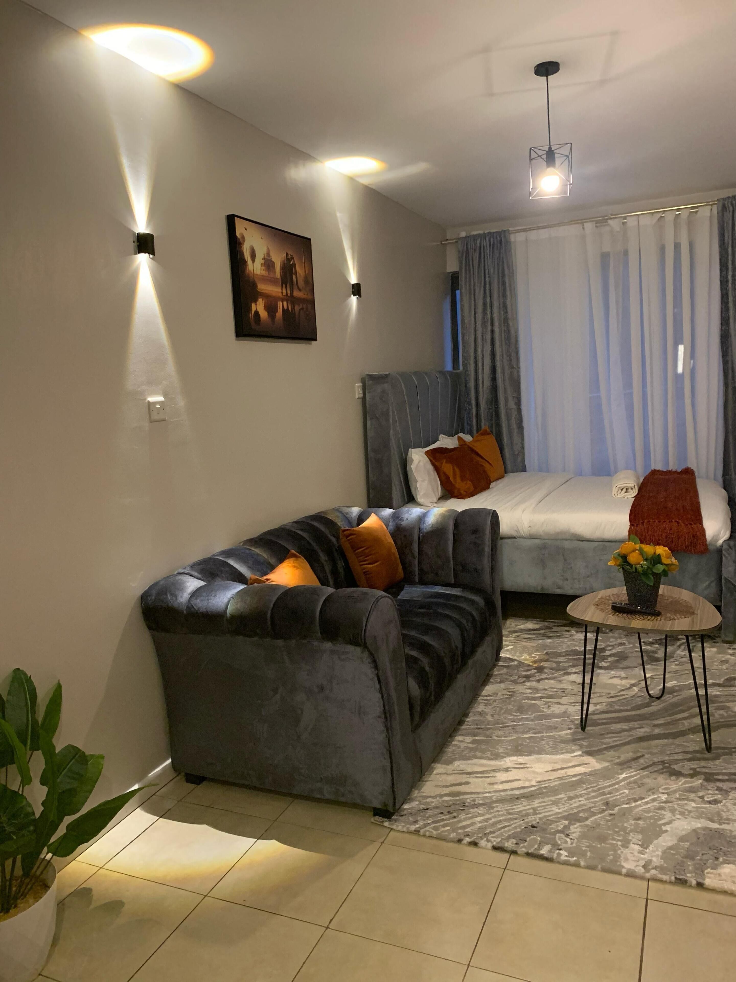 Deluxe Studio, City View | Living area | 32-inch Smart TV with digital channels