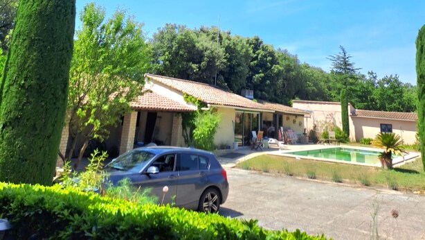 A residential area with a car parked in front of a house, a swimming pool, and a clear blue sky. - House in Provence (Chateauneuf de gadagne)