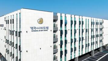 A modern hotel building with a sign reading "Cyeongju City Hotel".