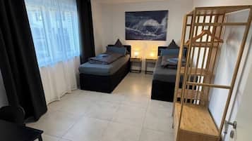 1 bedroom, desk, iron/ironing board, travel cot