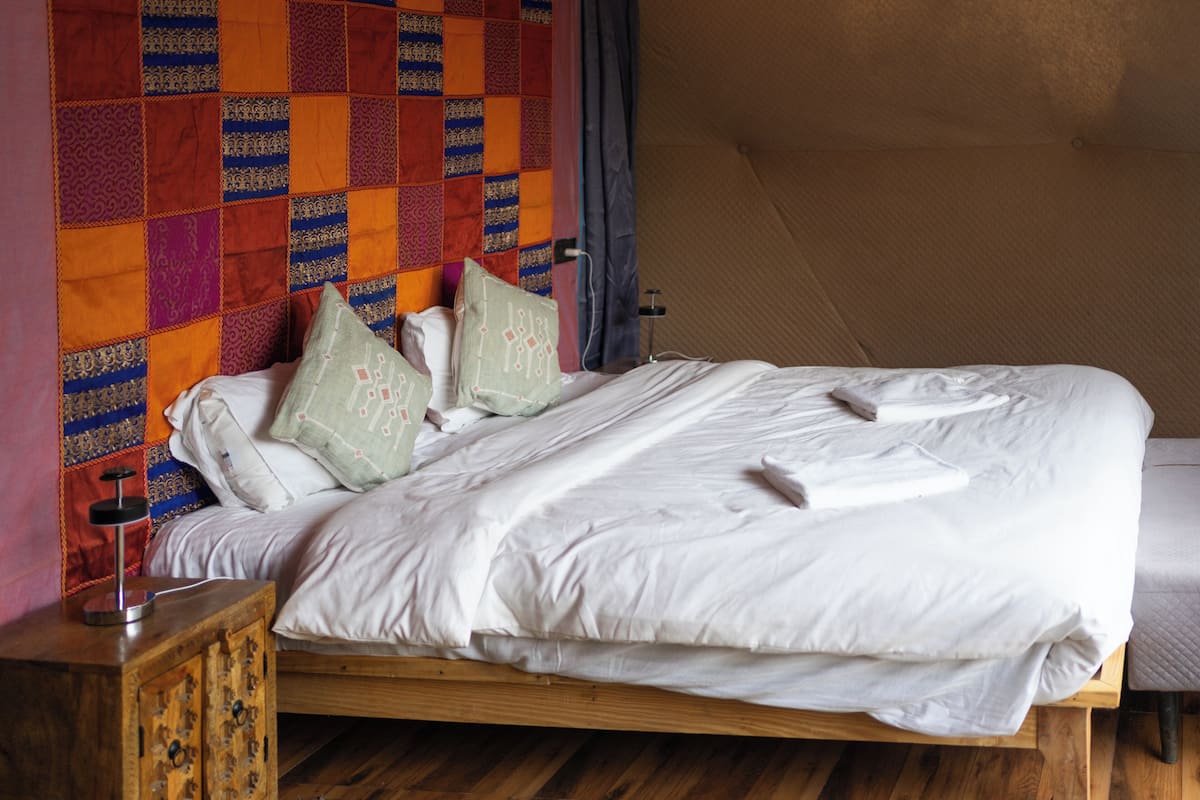 Premium bedding, down comforters, pillowtop beds, individually decorated