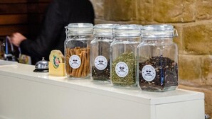 A counter with jars labeled "Mr. Coffee" containing various coffee-related items. - Senator Boutique Hotel Baku (Baku)