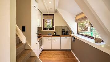 Fridge, dishwasher, highchair, dining tables