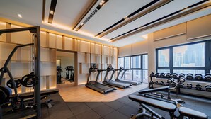 A modern gym with treadmills, weight benches, and dumbbells. - Agile Residence Dual-Key Gem @ Bukit Bintang F11 By Natol (Kuala Lumpur)