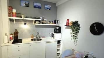 Fridge, microwave, stovetop, coffee/tea maker