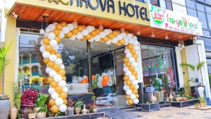 The exterior of the Arova Hotel with a large arch of white and gold balloons. - Arova Hotel (Nairobi)