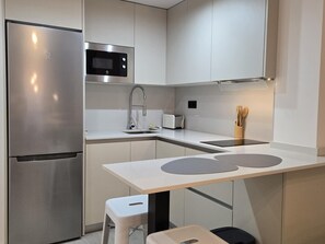 Fridge, microwave, coffee/tea maker, toaster