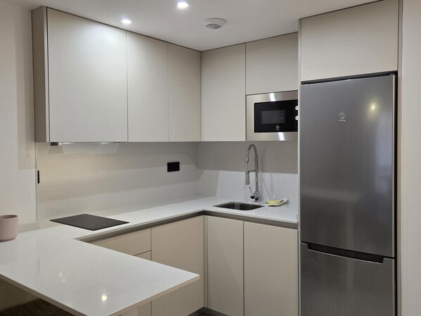 Fridge, microwave, coffee/tea maker, toaster