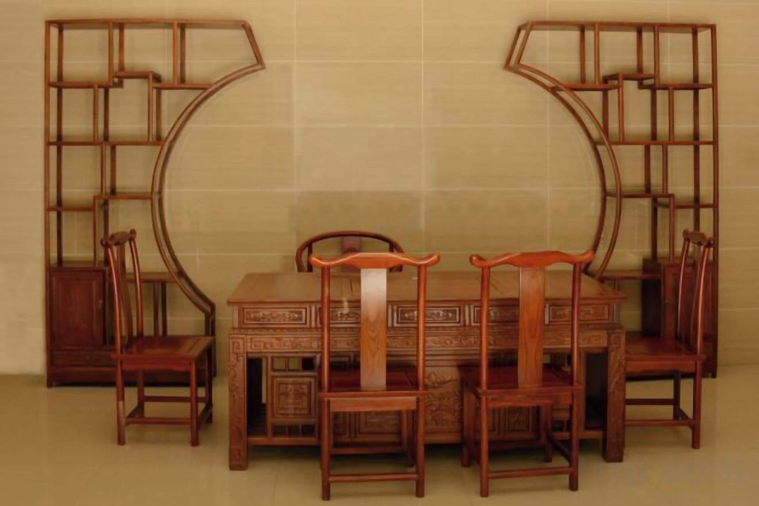 A dining set with a table and four chairs, accompanied by two wooden sideboards.