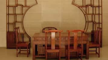 A dining set with a table and four chairs, accompanied by two wooden sideboards.