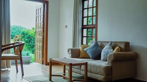 Family Suite, 1 Bedroom, Ensuite | Living area | 50-inch Smart TV with satellite channels - Mateves Boutique Lodge  (Arusha)