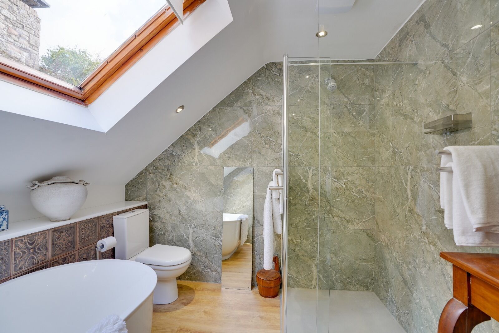 Shower, hair dryer, towels, toilet paper