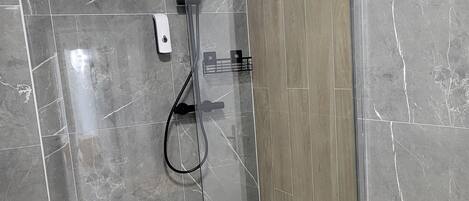 Shower, hair dryer, towels, soap