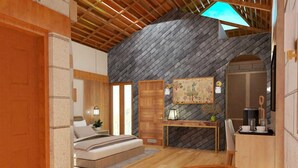 A bedroom with a sloped ceiling, a bed, a desk, and a fireplace. - Sunday Hotel Dharamshala (Dharamshala)