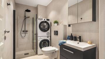 Shower, hair dryer, towels, soap