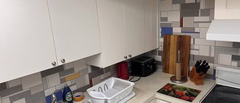 Fridge, microwave, stovetop, coffee/tea maker