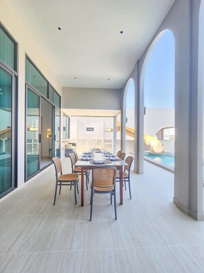 Deluxe Villa, Pool View | Living area | 32-inch flat-screen TV with cable channels