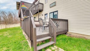 A wooden deck with outdoor furniture, a staircase, and a house with horizontal siding. - 5 Mi to Rutgers University: New Jersey Guest Suite (South River)