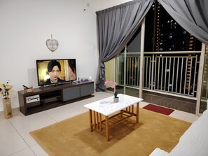 Apartment, City View | Living area | 32-inch LED TV with digital channels