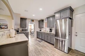 Fridge, microwave, oven, stovetop - dog-friendly home with fenced yard, grill, sunroom (San Antonio)