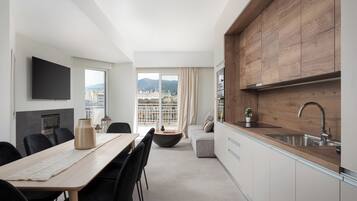 Classic Apartment, Balcony, City View | Living room | Smart TV, fireplace, Netflix, books