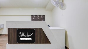 A reception desk with a sign that reads "Collection Company-Serviced." - Collection O Civil Lines Near Old Bus Stand (Bareilly)
