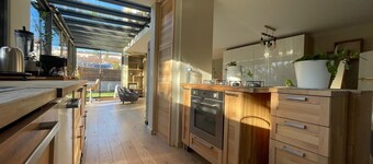 Design villa with glass roof and parquet flooring, garden and fitness center near downtown