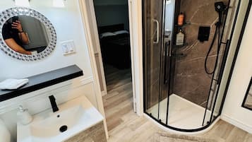 Shower, hair dryer, towels, soap