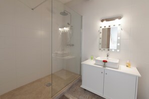 Shower, hair dryer, towels, soap