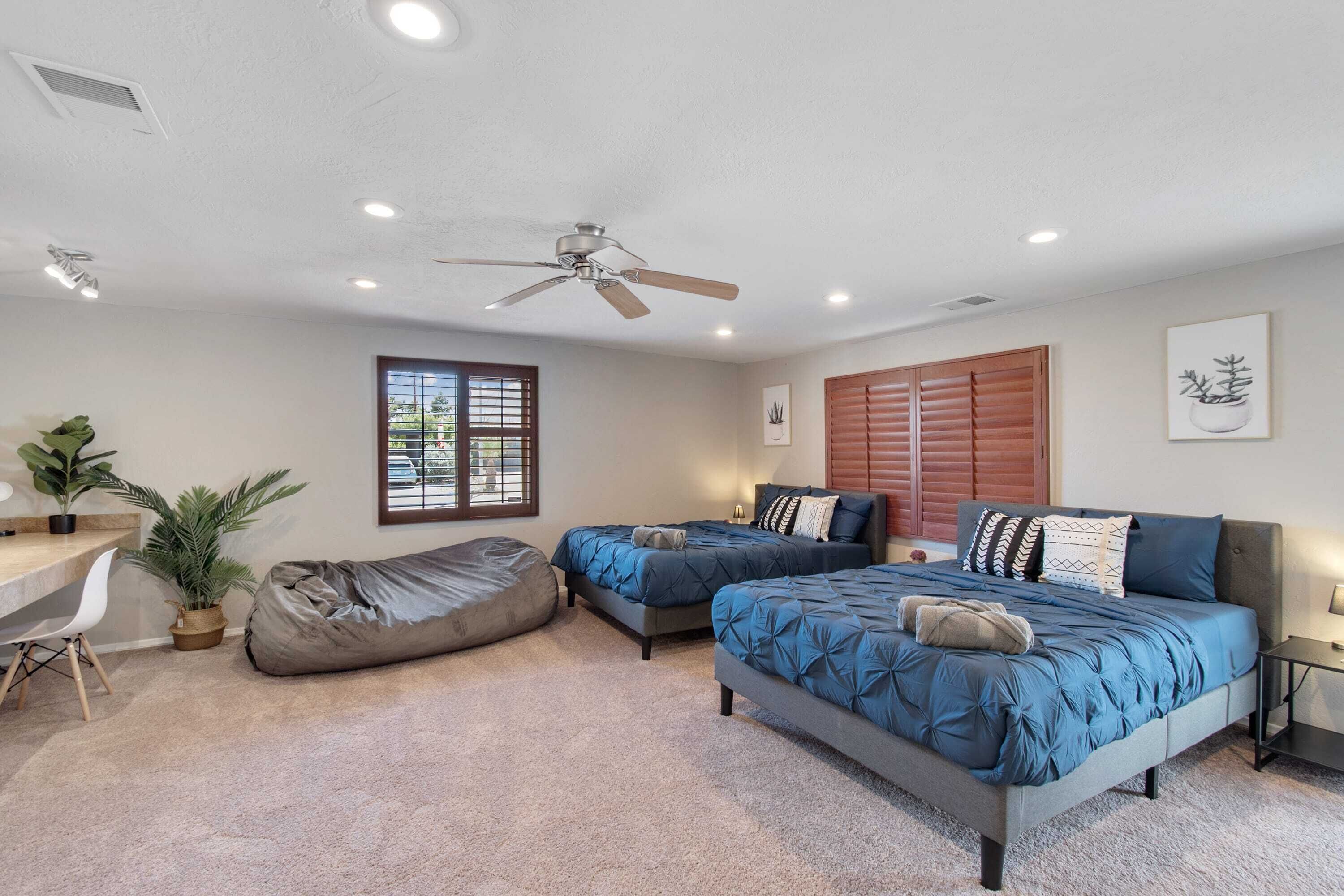 The third bedroom is spacious and has two beds