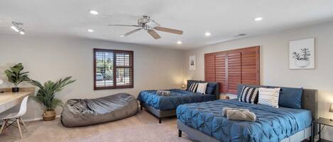 The third bedroom is spacious and has two beds