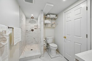 Shower, jetted tub, hair dryer, towels