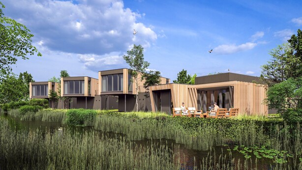 Una casa moderna con techo plano, amplias ventanas y una terraza de madera con vistas a un lago.