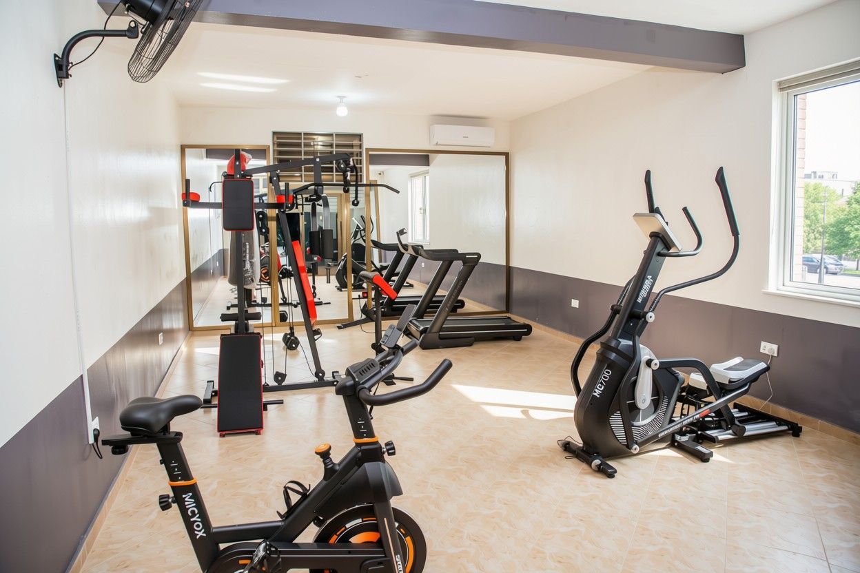 A gym with stationary bikes, treadmills, and weight machines.