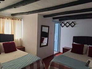 Standard Quadruple Room | Premium bedding, blackout drapes, iron/ironing board, free WiFi - San Miguel Villa Hotel's VDL (Villa de Leyva)
