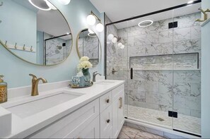 Shower, hair dryer, towels, soap