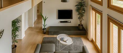 Superior Apartment, Garden View | Living area | Flat-screen TV