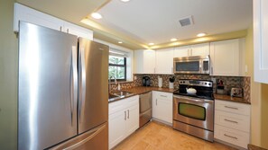 Fridge, microwave, oven, stovetop - Beautiful beachfront condo with wraparound balcony and endless ocean views! (Sarasota)