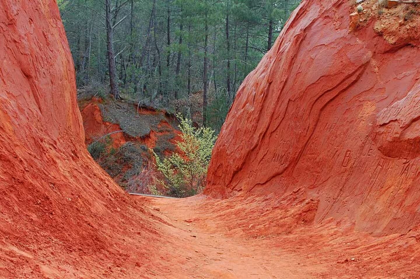A natural rock formation with a narrow passageway.