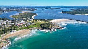 An aerial view of a coastal town with a beach, marina, and residential area. - Seaspray 6 - Short walk to the beach and Yamba's CBD (Yamba)