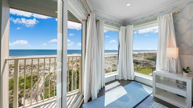A balcony with a view of the beach and ocean. - La Mer on 10th - A Luxurious holiday stay! (St. Augustine Beach)