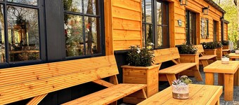 Nice cozy cozy cottage on edge of dirt road and view over meadow.