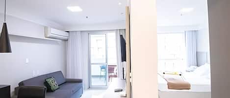 Basic Apartment | Living area | 30-inch TV with cable channels