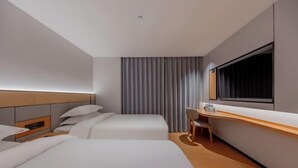 A hotel room with two beds, a desk, a chair, a large window, and a curtain. - 8 Days Hotel (Minhang Jiaotong University Branch) (Shanghai)