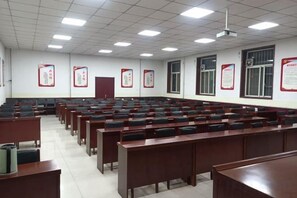 A classroom with rows of desks and chairs, a projector, and educational posters on the walls. - Anxin Express Hotel (Shijiazhuang New Railway Station East Plaza) (Shijiazhuang)