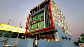 A hotel with a modern design, featuring a prominent signage for 'Hotel Dev Inn' and a clear view of the entrance. - HOTEL DEV INN (Dhangadhi)