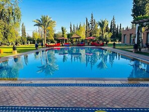 Outdoor pool, pool umbrellas, sun loungers