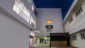 A modern building with a sign reading "TOWNHOUSE." - Super Townhouse Arcot Road (Chennai)