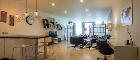 Comfort Apartment, 1 Bedroom, Kitchenette, City View | Living room | 52-inch flat-screen TV with digital channels