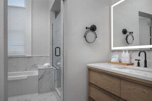 Legacy King with Sofa Sleeper | Bathroom | Hair dryer, bathrobes, slippers, towels